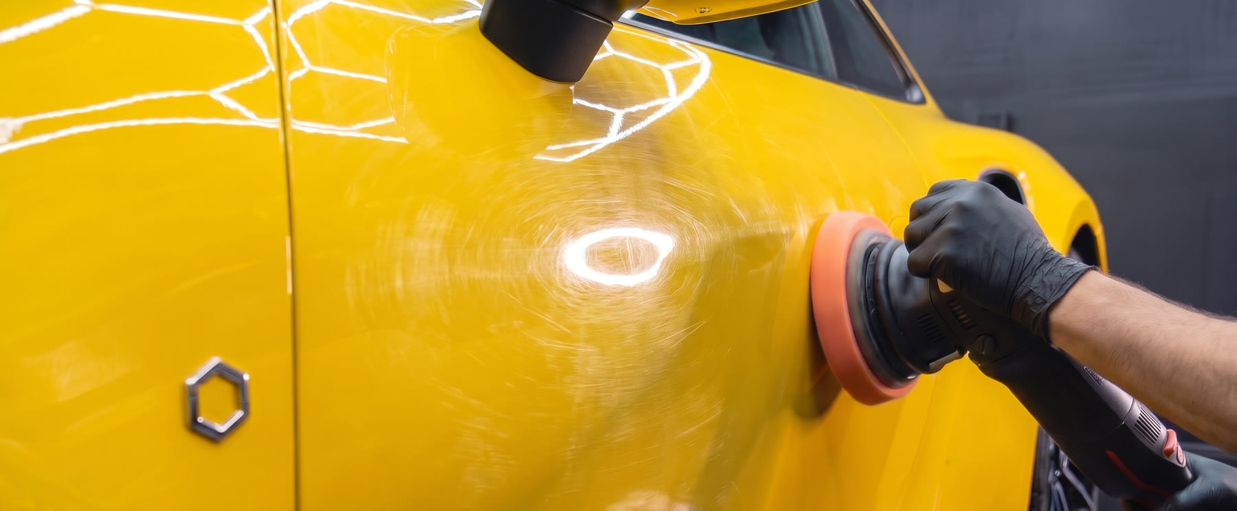 Door before paint correction, covered in swirl marks